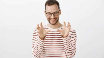 male model striped pullover glasses