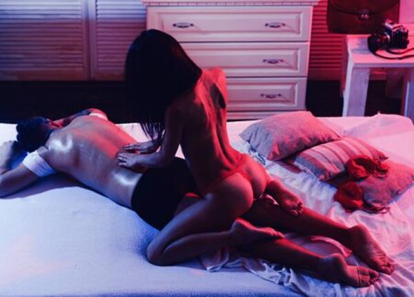 women giving Nuru massage to men