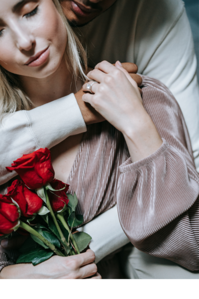 men hugging girl from behinde